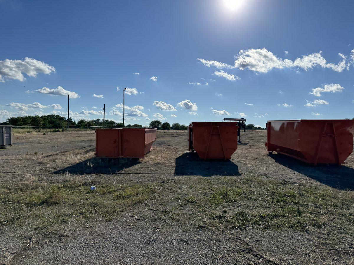 Lot grading after demolition on a Mid-Missouri teardown site, with the pad cut flat and shaped to drain after the structure was removed