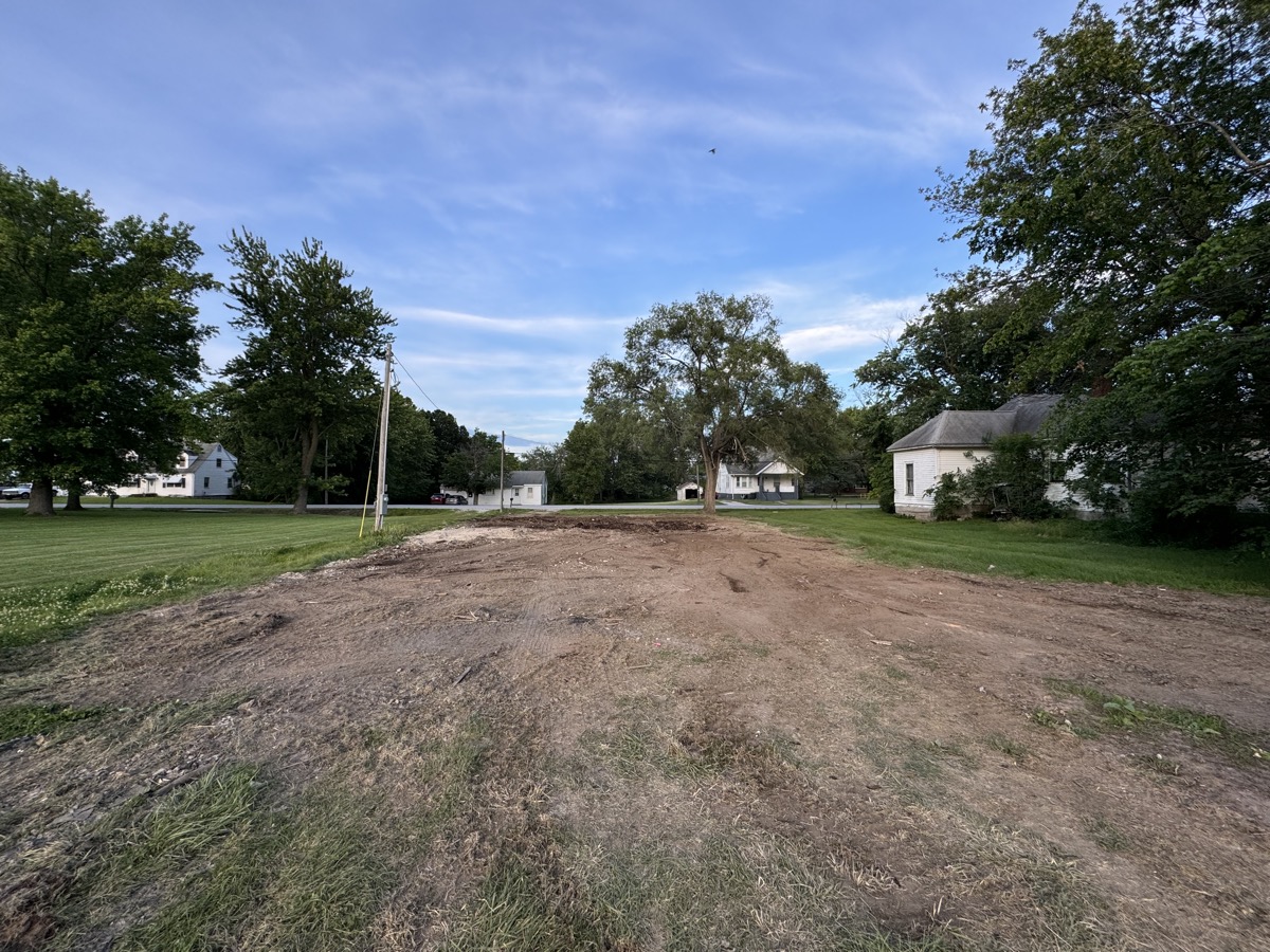 Freshly graded lot ready for construction showing proper drainage slope