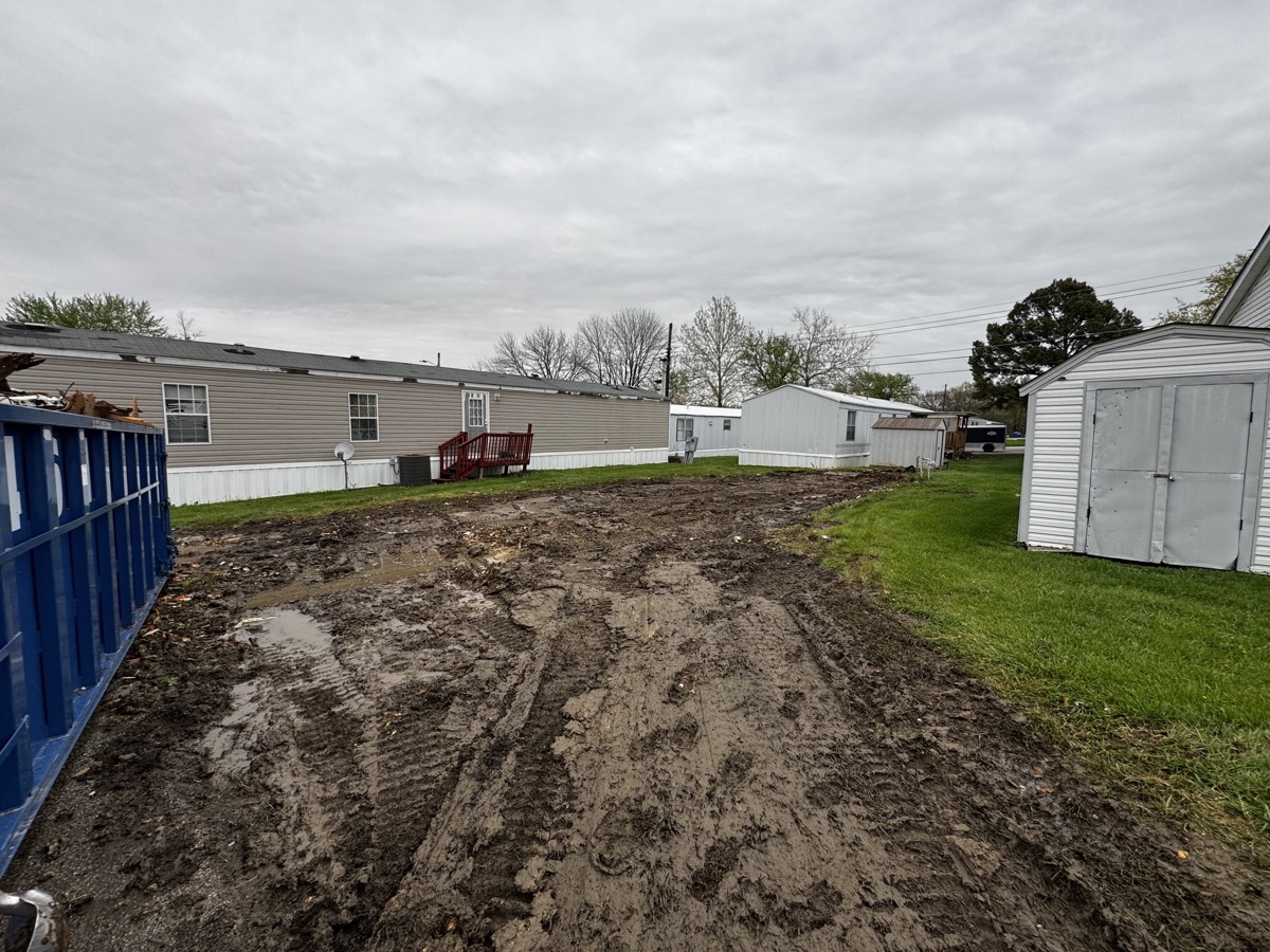 Cleared and graded site ready for new construction in mobile home park